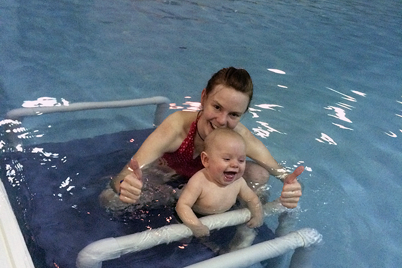 SNP-pool swim teach and student doing back float