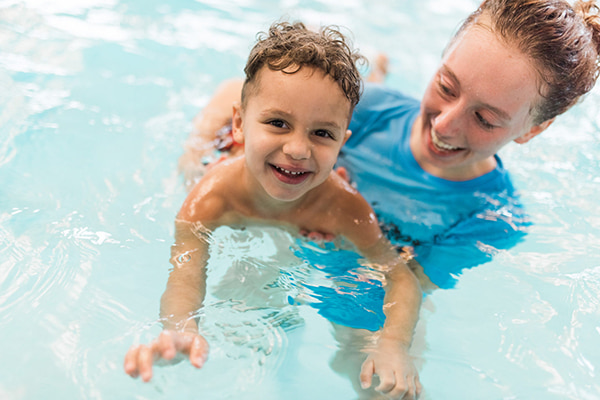 swim teacher with student swim teacher with student