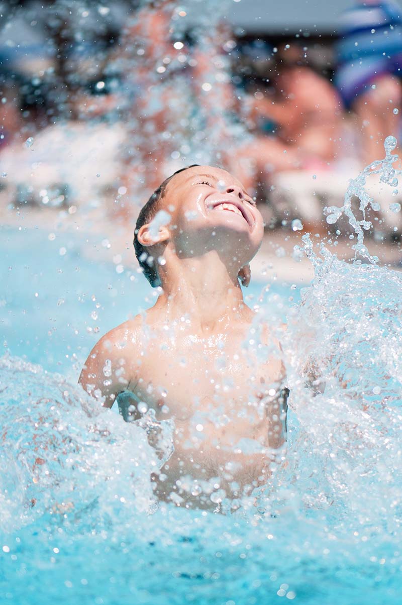 Boy-splashing Swim lessons are a unique holiday idea for kids