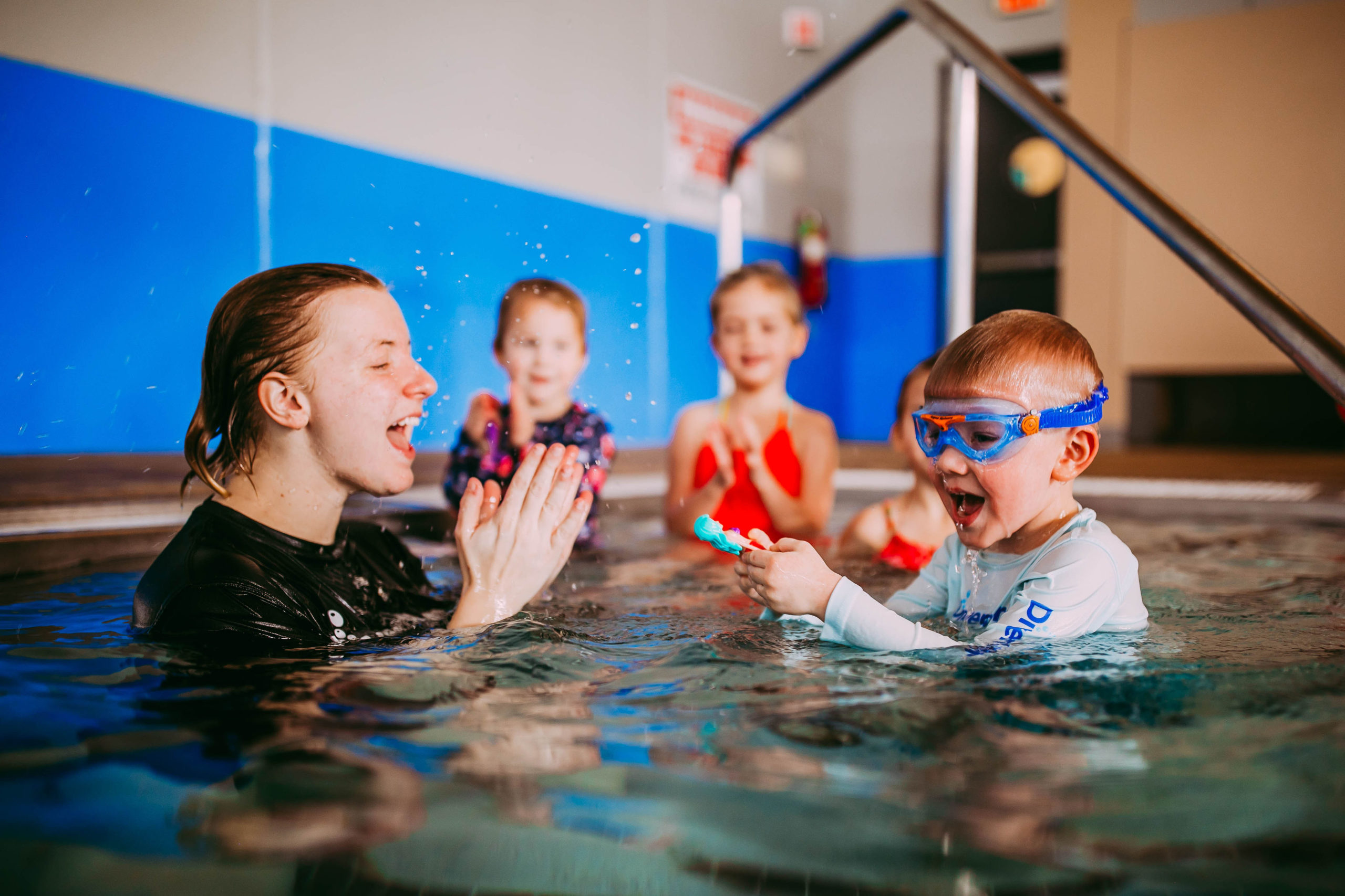 swimming instructor with face shield