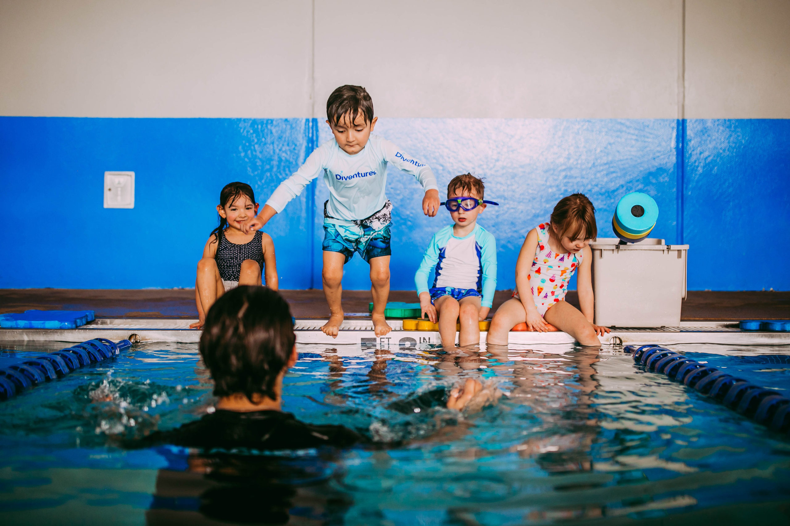 swim teach and student doing back float