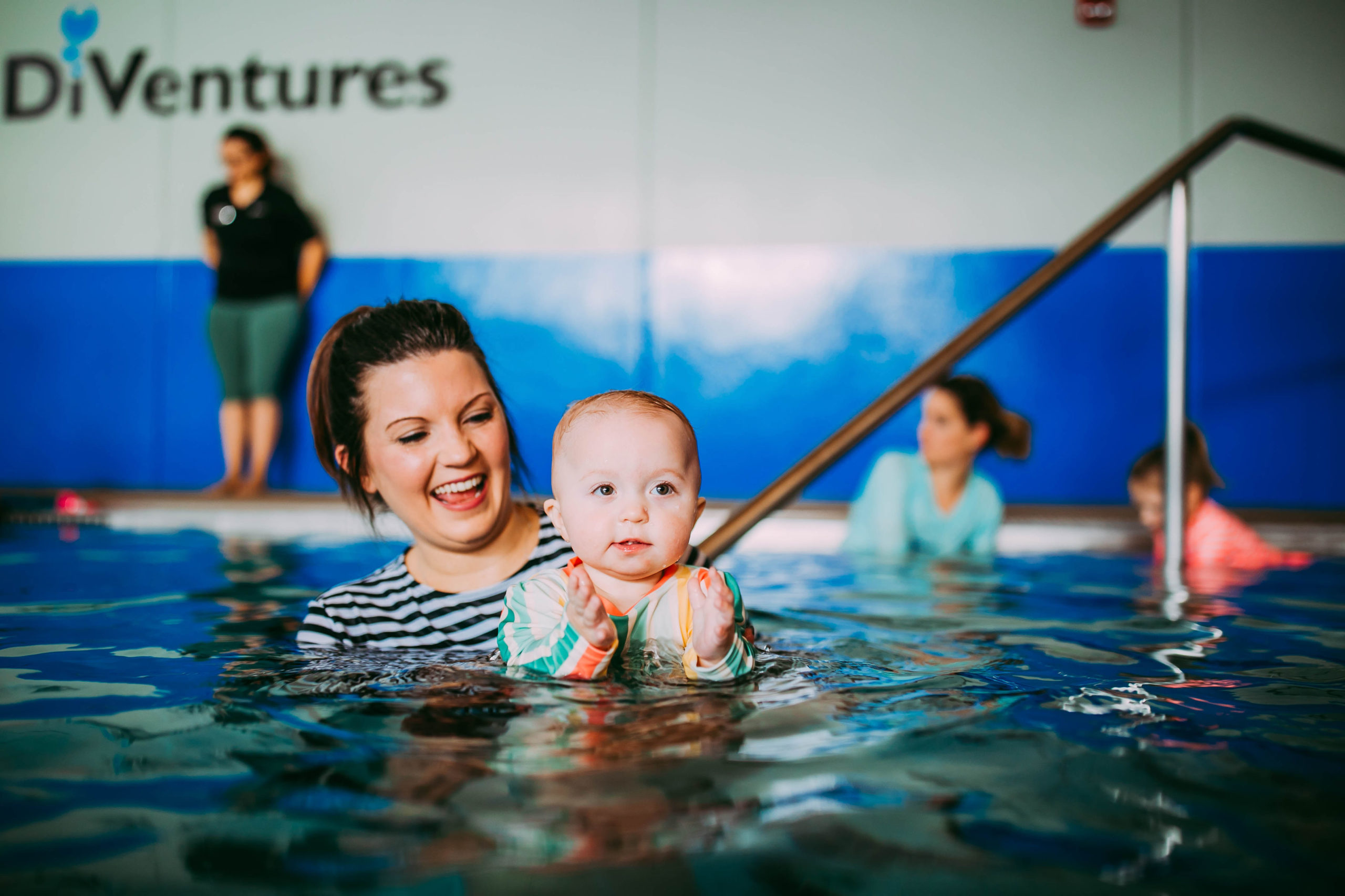 swim teach and student doing back float