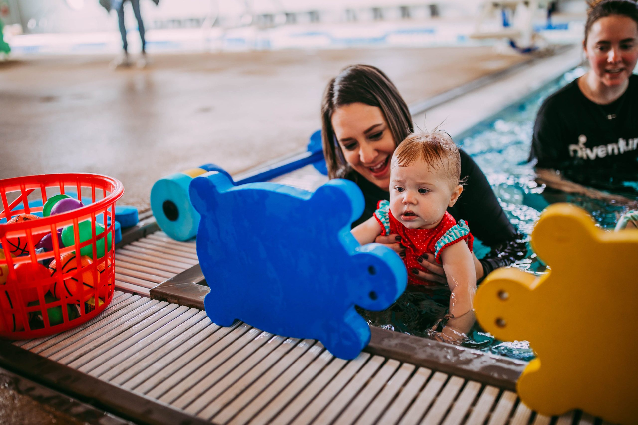 swim teach and student doing back float