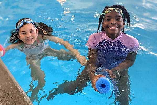 kids swimming smiling