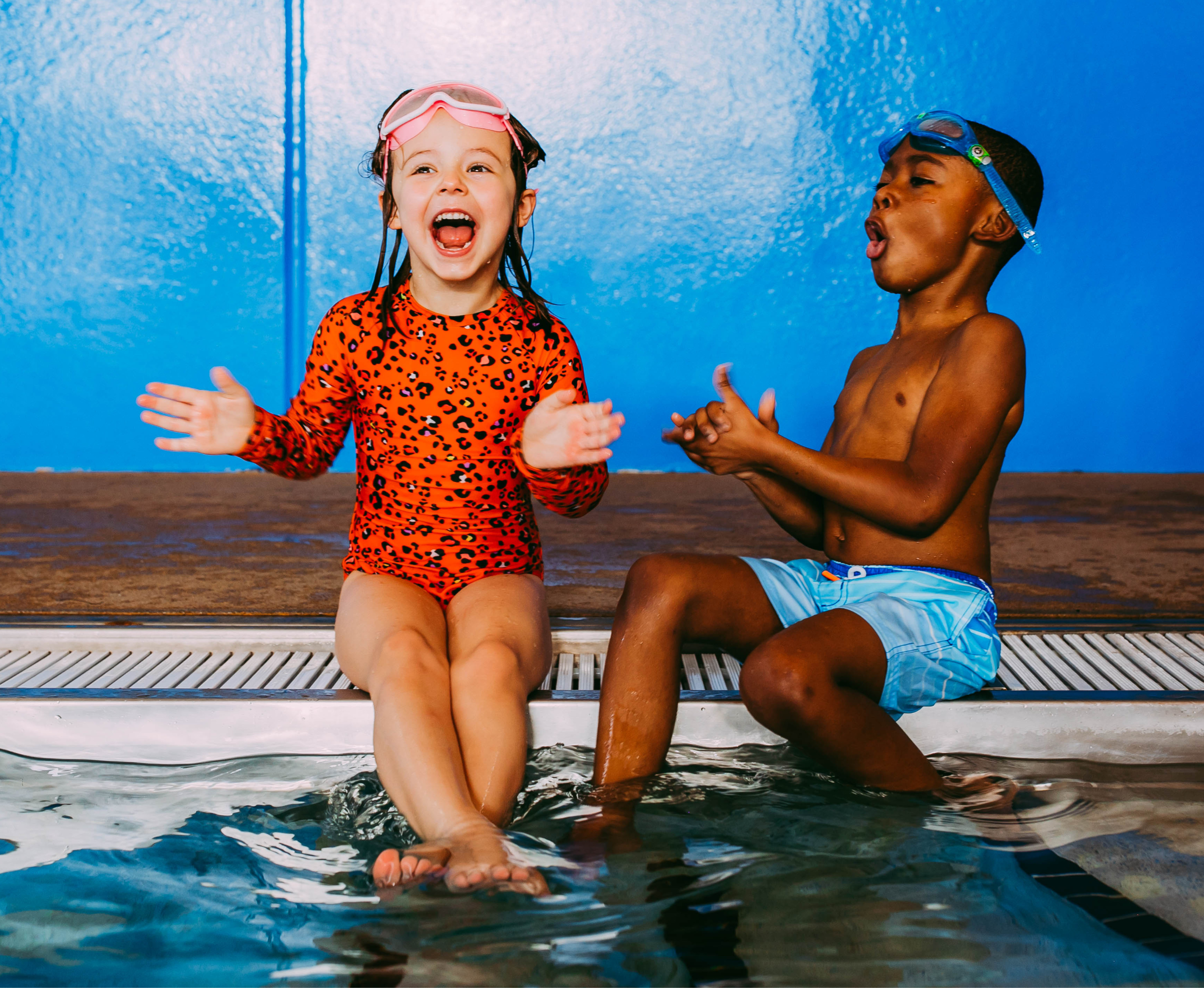 two swim students smiling