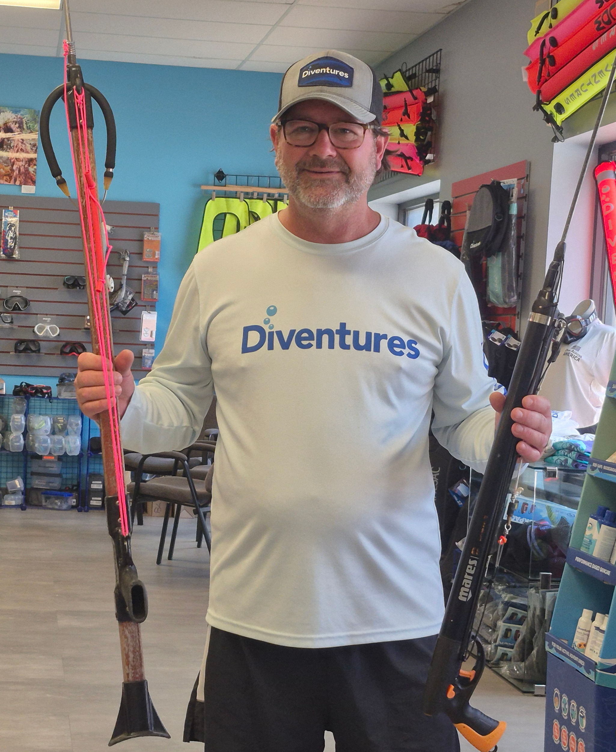Scott McCrory holding spearfishing gear